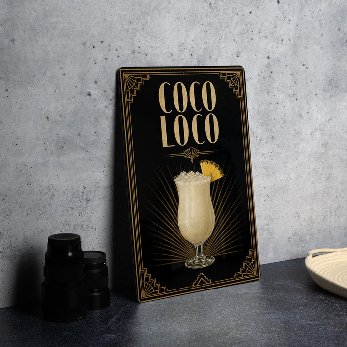 A framed poster advertising a cocktail called "Coco Loco" with a glass illustration of the drink.