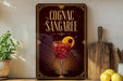 a decorative sign for a Cognac Sangaree cocktail, with a glass of the drink and garnish visible.