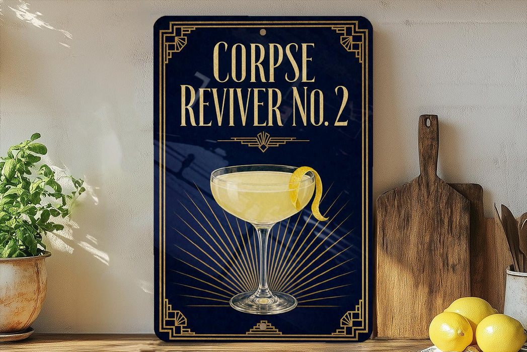 a decorative sign with a cocktail glass and lemon on a wooden surface, accompanied by a wooden cutting board and a potted plant.
