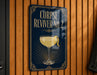 A sign for "CORPSE REVIVER NO. 2" is displayed on a wooden wall.