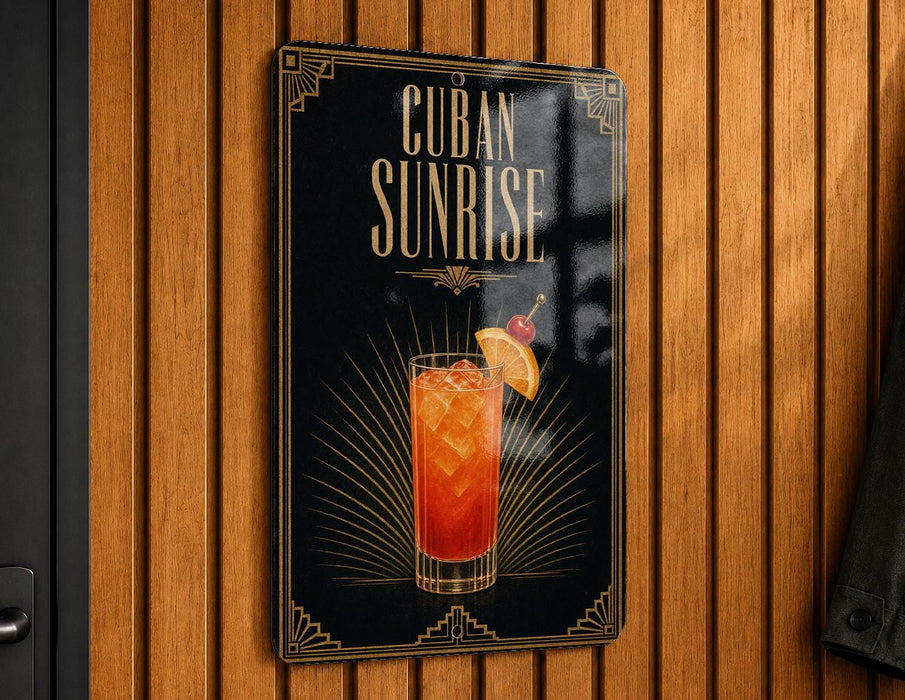 A sign for "Cuba Sunrise" cocktail, featuring an illustration of a cocktail glass with a slice of orange and a cherry on top, against a wooden background.