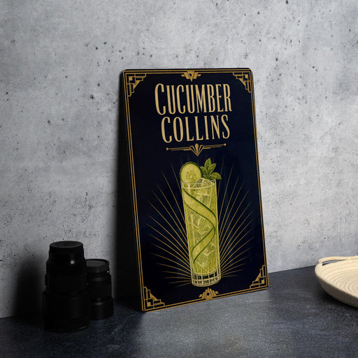 a decorative sign for a cucumber Collins cocktail, with a glass illustration and text.