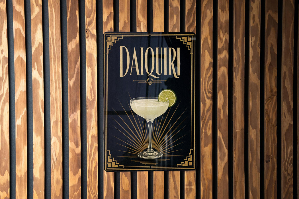 A sign for "Daiquila" is displayed on a wooden wall, featuring an illustration of a cocktail glass with a lime slice.