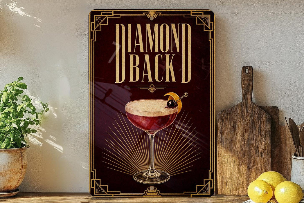 a decorative sign with a glass of red cocktail and a lemon on a wooden surface, accompanied by a wooden cutting board and a potted plant.