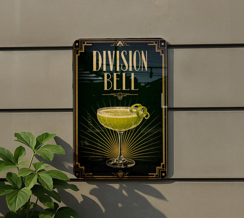 a sign for "Division Bell", which is a cocktail, mounted on a wall.