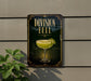 a sign for "Division Bell", which is a cocktail, mounted on a wall.