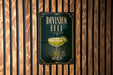 A sign for "Division Bell" cocktail is displayed on a wooden wall.
