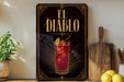 a decorative sign for "El Diablo", a cocktail, with a glass illustration and a lemon slice.