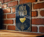 a sign with the text "Final Ward" and an illustration of a cocktail glass with a lemon twist.