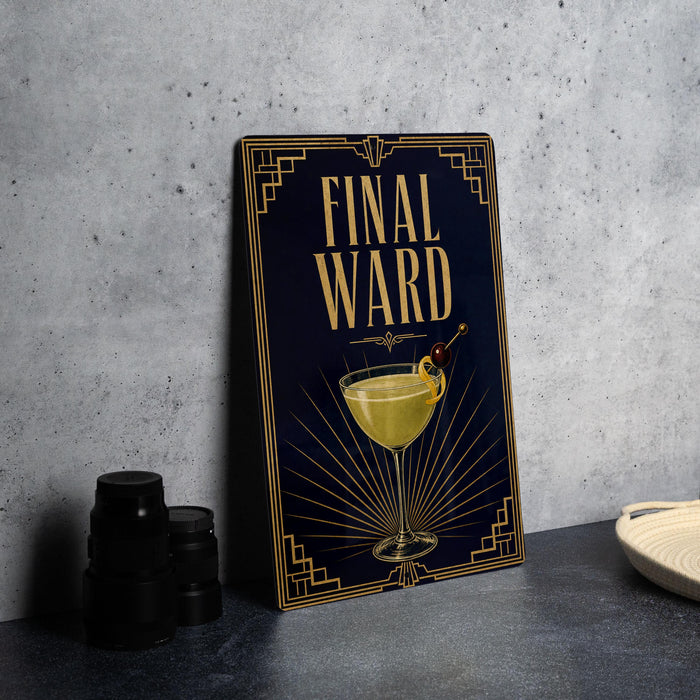 a framed artwork or poster with a design of a cocktail glass and the text "FINAL WARD" on it, placed on a table next to some black camera lenses.