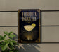 A sign for "Florida Daiquiri" is displayed on a wall, featuring an illustration of a cocktail glass with a lemon slice.