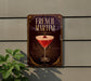A sign for French Martini is displayed on a wall, featuring an illustration of a martini glass with a cherry on top.