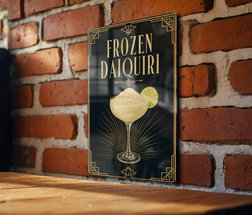 A sign for a frozen daiquiri cocktail is displayed on a brick wall.