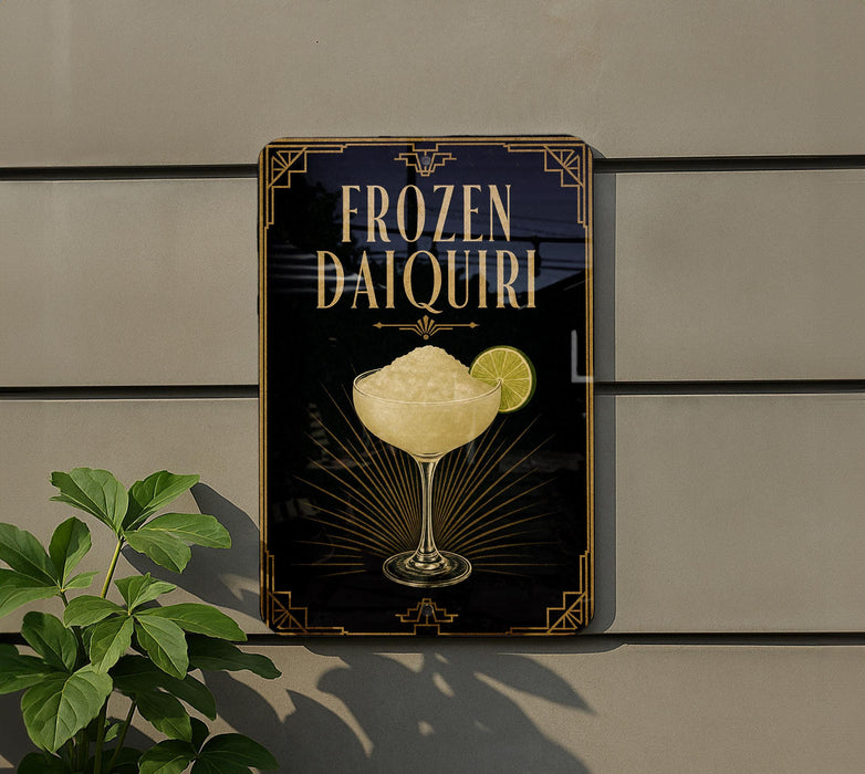 A sign for a frozen daiquiri cocktail is displayed on a wall, with a glass of daiquiri and a lemon slice visible.