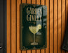A sign for "Garden Gimlet" is displayed on a wooden wall.