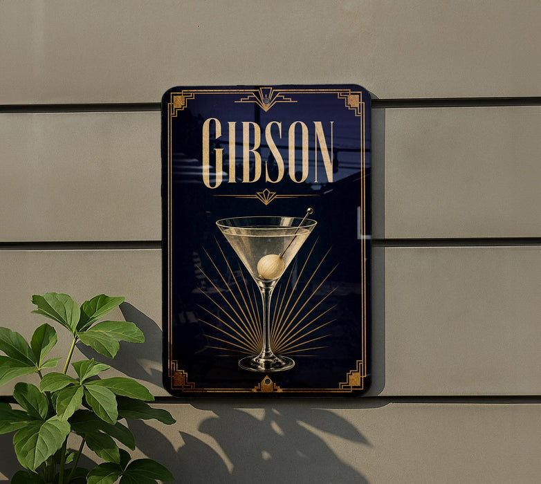 A sign for a bar called "Gibson" with an illustration of a martini glass on it, mounted on a wall.