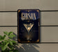 A sign for a bar called "Gibson" with an illustration of a martini glass on it, mounted on a wall.