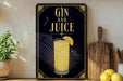 A decorative sign with the text "GIN AND JUICE" and an illustration of a cocktail glass with a lemon slice.