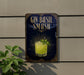 A sign for a gin smash cocktail, featuring a glass of the drink with a sprig of basil on top, against a dark background with decorative elements.