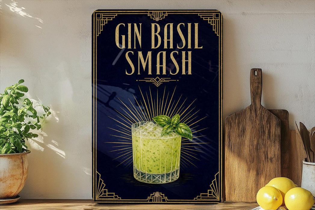 A framed poster advertising a Gin Basil Smash cocktail, featuring a glass of the drink and a basil leaf, is displayed on a wall next to a wooden cutting board and a potted plant.