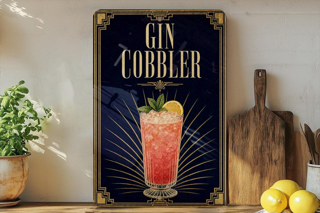 A framed poster advertising a Gin Cobbler cocktail, featuring a glass of the cocktail with a lemon slice and mint leaves.