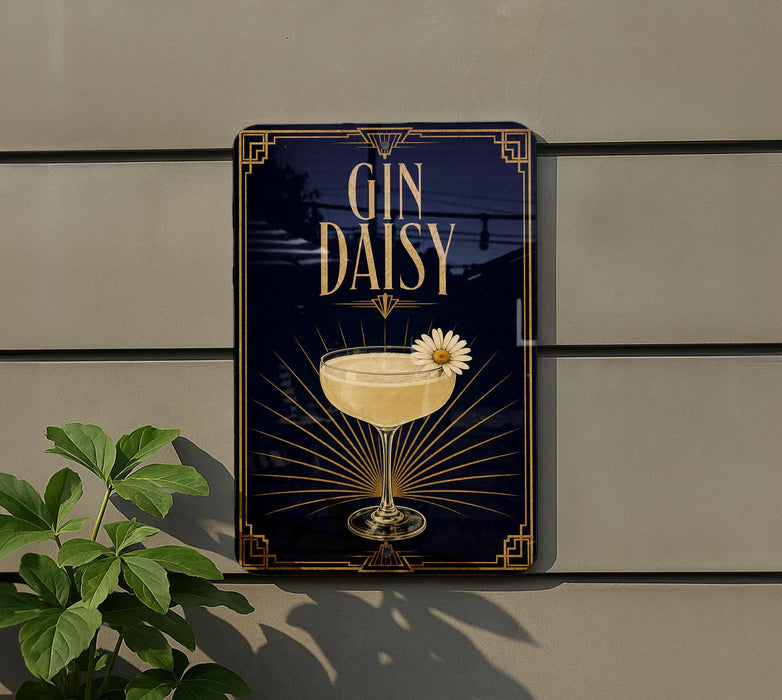 A decorative sign for a gin and daisy cocktail, featuring a glass of the drink and a flower on the rim.