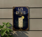 A sign for "Gin Rickey" is displayed on a wall, featuring an illustration of a gin and tonic glass with a lemon slice.
