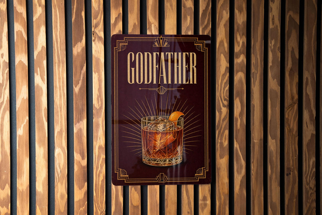 A sign for a bar called "GODFATHER" with an illustration of a cocktail on it.