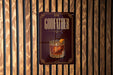 A sign for a bar called "GODFATHER" with an illustration of a cocktail on it.