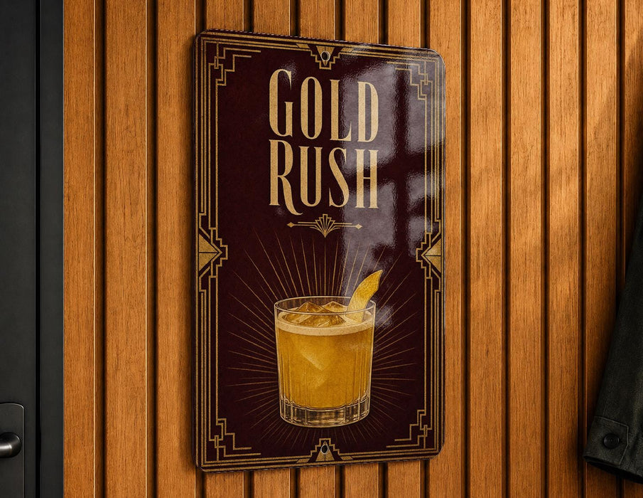 A sign with the text "GOLD RUSH" and an illustration of a cocktail glass with a lemon slice.