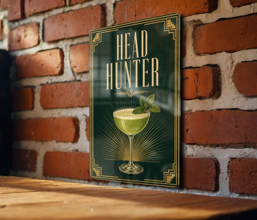 a sign with the text "HEAD HUNTER" and an illustration of a cocktail glass with a mint leaf.