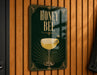 A sign with the text "HONEY BEE" and an illustration of a cocktail glass with a lemon slice.