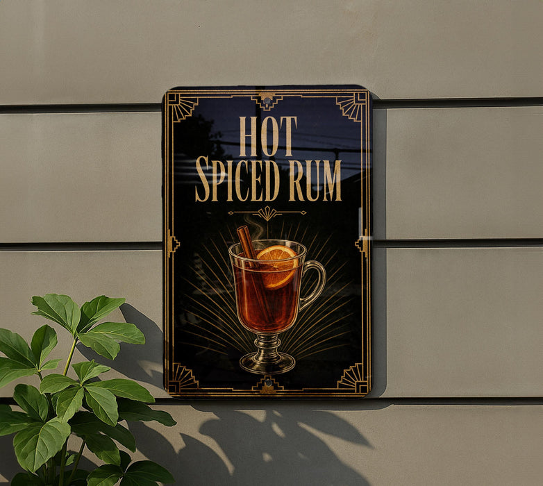 A sign advertising "Hot Spiced Rum" is displayed on a wall, featuring an illustration of a glass filled with a warm, spiced rum drink garnished with a lemon slice and a cinnamon stick.