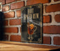 A sign with the text "HOT SPICED RUM" and an illustration of a glass of hot spiced rum with a slice of lemon and a cinnamon stick.