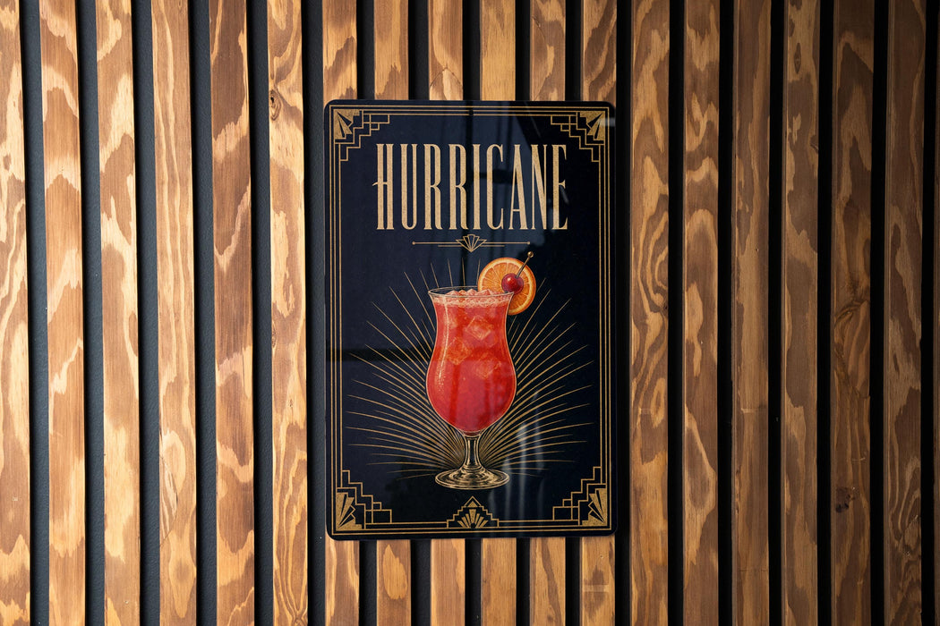 A poster with the word "HURRICANE" prominently displayed, featuring an illustration of a cocktail with a slice of orange.