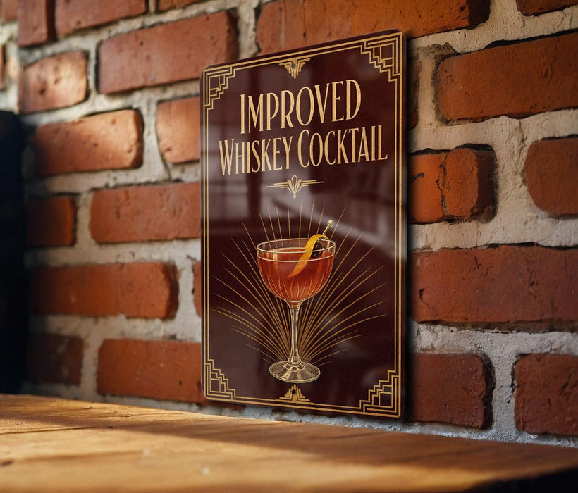 a sign with the title "IMPROVED WHISKEY COCKTAIL" and an illustration of a cocktail glass with a lemon slice.