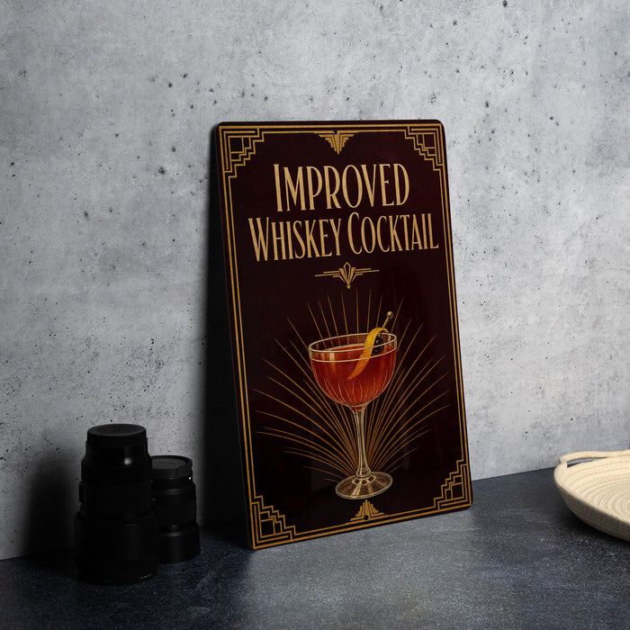 a sign with the text "IMPROVED WHISKEY COCKTAIL" and an illustration of a cocktail glass with a lemon slice.