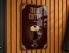 A sign for Irish coffee is displayed on a wooden wall.