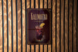 A sign for a drink called "Kalimotxo" is displayed on a wooden wall.