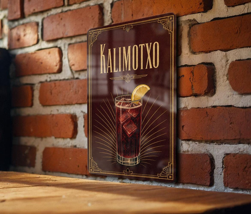 A framed illustration of a cocktail with a lemon slice on a brick wall.