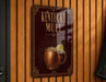 A sign for Kentucky Mule, featuring an illustration of a copper mug with a lemon slice, against a wooden background.