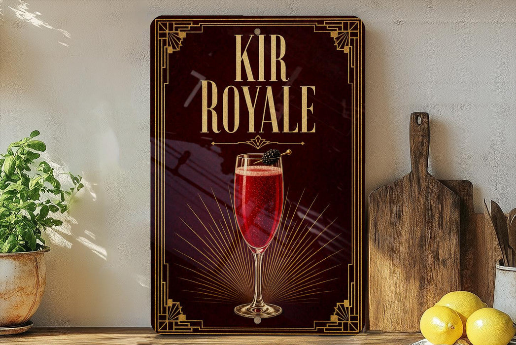 a decorative sign for a beverage called "Kir Royale", with a glass of red liquid and a garnish on the sign.