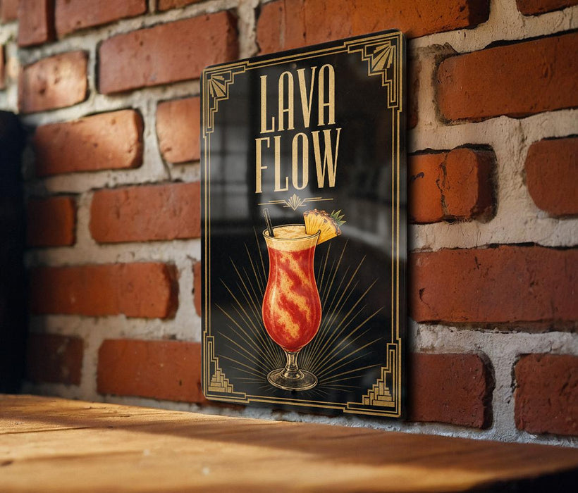A framed poster with the text "Lava Flow" and an illustration of a colorful drink is displayed on a brick wall.