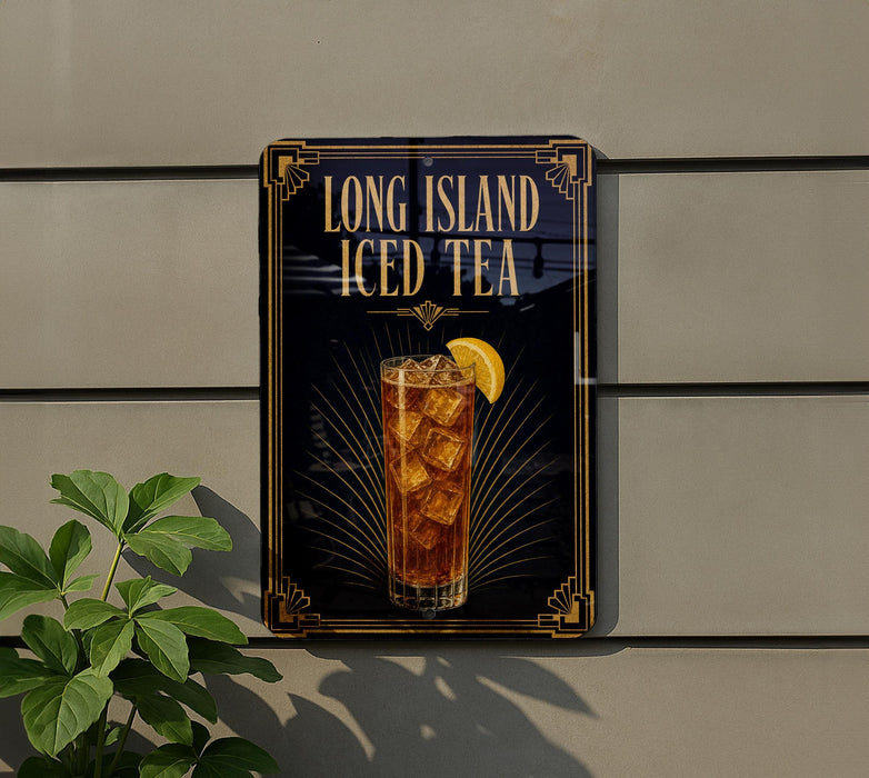 A sign for Long Island Iced Tea, featuring a glass of iced tea with a lemon slice, is displayed on a wall next to a plant.