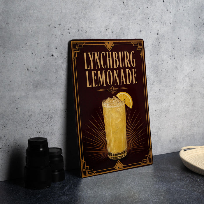 A framed advertisement for Lynchburg Lemonade, featuring an illustration of a tall glass filled with the refreshing beverage and a lemon slice.