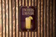 A sign for Lynchburg Lemonade is displayed on a wooden wall.