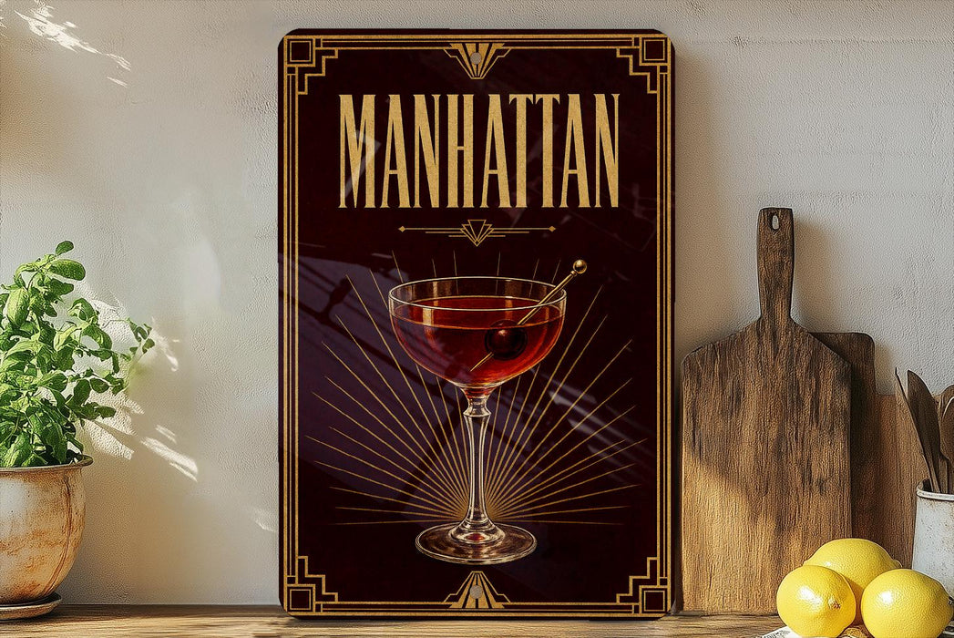 A framed poster of a Manhattan cocktail is displayed on a wall, with a wooden cutting board and a potted plant to the side.