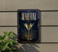 A sign with the word "MARTINI" prominently displayed, featuring a martini glass with an olive garnish.