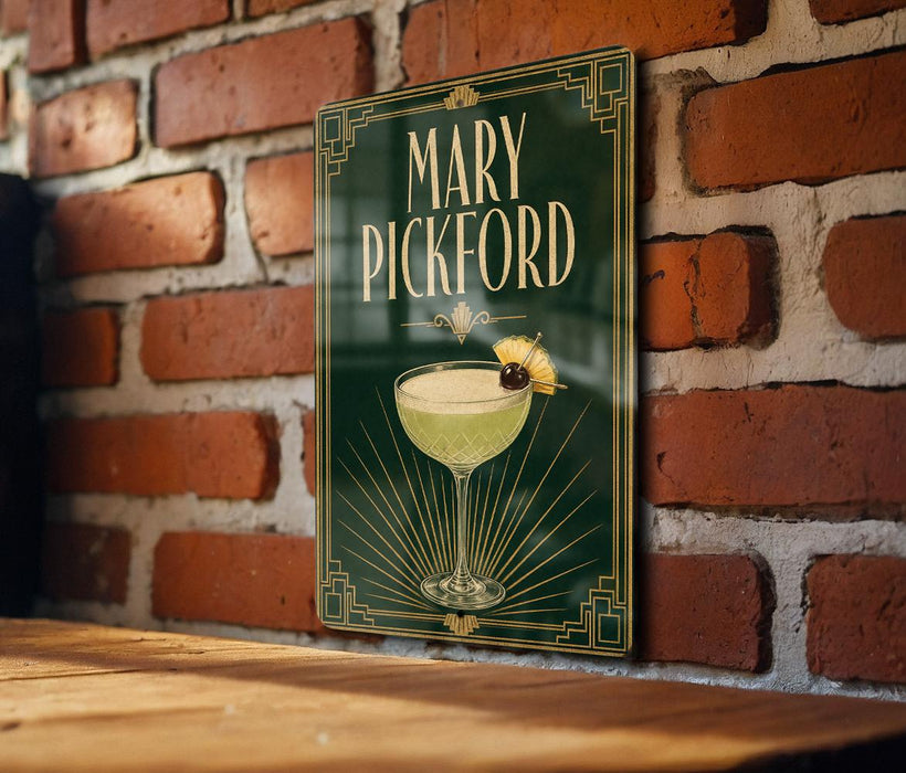 A decorative sign featuring the name "Mary Pickford" and an illustration of a cocktail glass with a lemon twist.
