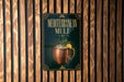 A sign for a Mediterranean Mule cocktail is displayed on a wooden wall.
